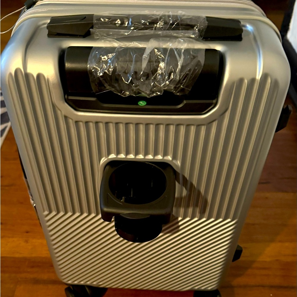 Brand new. Chrome hard shell carry on Luggage.